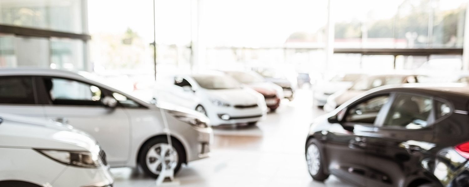 Motor fleet insurance: Inside a car showroom.
